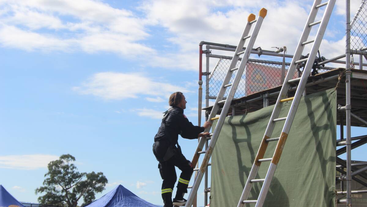 Ascending the tower, a FRNSW member works with speed and skill - Dan Ryan