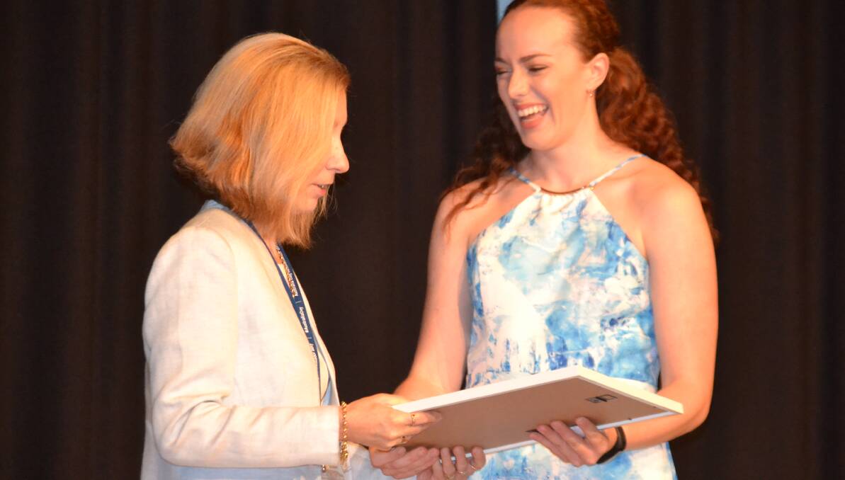 Cowra's Young Citizen of the Year Maddi Johnson received her award from Australia Day ambassador Cheryl Koenig.