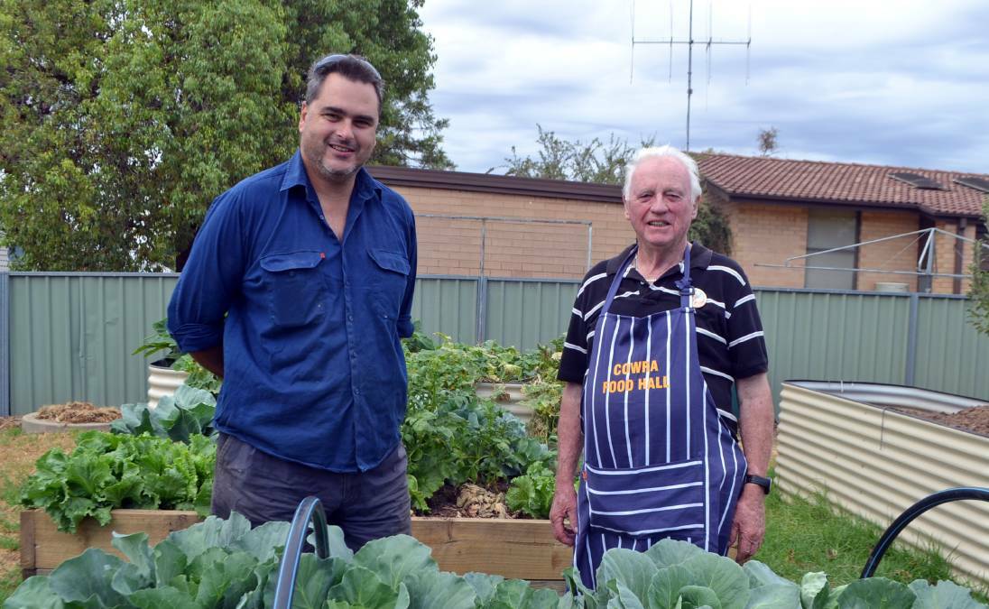 Darren Hall and Roy Cox in the Cowra Food Halls garden.The generosity and kindness provided by the Cowra Community makes a positive difference in the lives of so many.