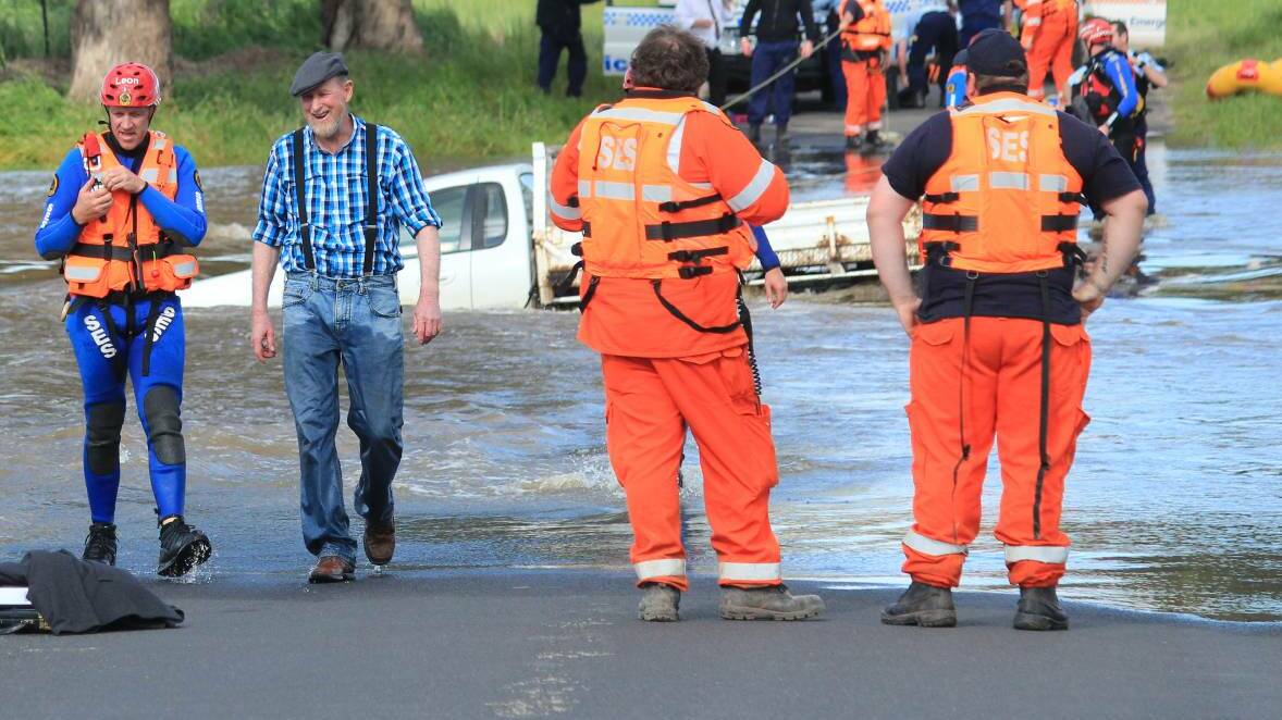Rescuers attempted to talk a man into allowing them to rescue him for six hours after he was trapped in a flooded causeway near Cowra on Friday.