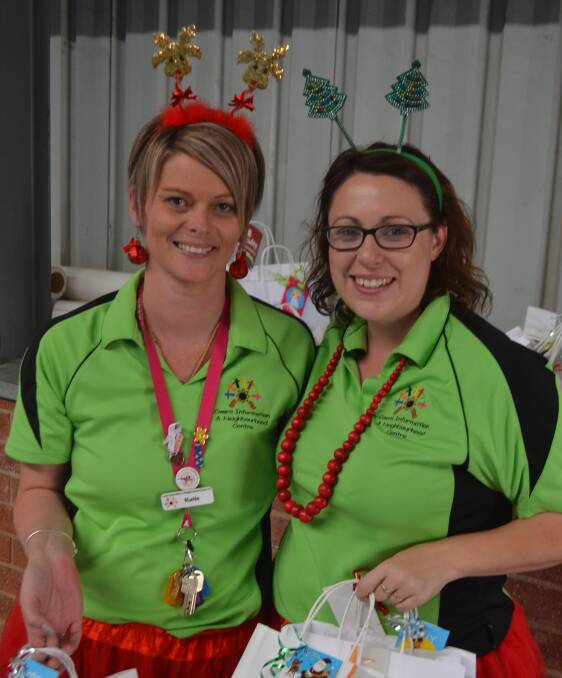 Santa's helpers Katie Wilson and Trish Gunderson at the Neighbourhood Centre Christmas party.