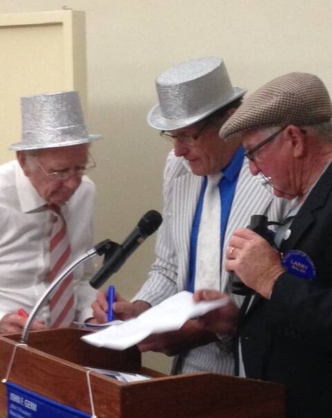 The "Spiv Brothers" consult over the result of Larry Walsh's Phantom Call at Rotary last week.