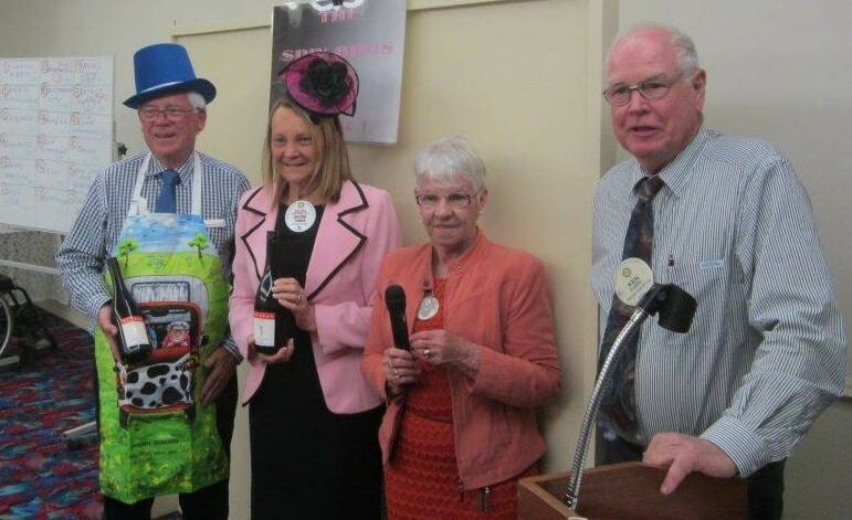 Judges Ken Harris and Diane Walsh with fashions winners Ross Ballinger and Heather Yarker at Rotary last week.