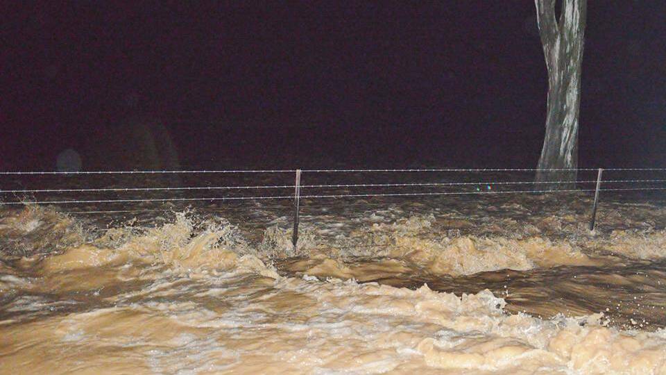 Flood waters on Barrs Road near Cowa on Friday evening. Photo by Louise Buckley.