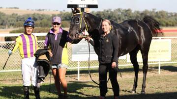 Winning jockey Leandro Ribeiro, winning trainer Connie Greig, and strapper Amber Collins with Grenfell Picnic Cup winner Valadyium. Image: Jeff Hanson/NSW Country and Picnic Racing
