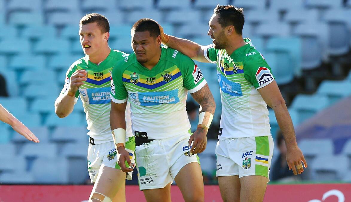 STAYING IN GREEN: Orange's Jack Wighton celebrates a try with Joey Leilua and Jordan Rapana. Leilua re-signed with Canberra leading into Saturday's game in Bathurst. Photo: GETTY IMAGES