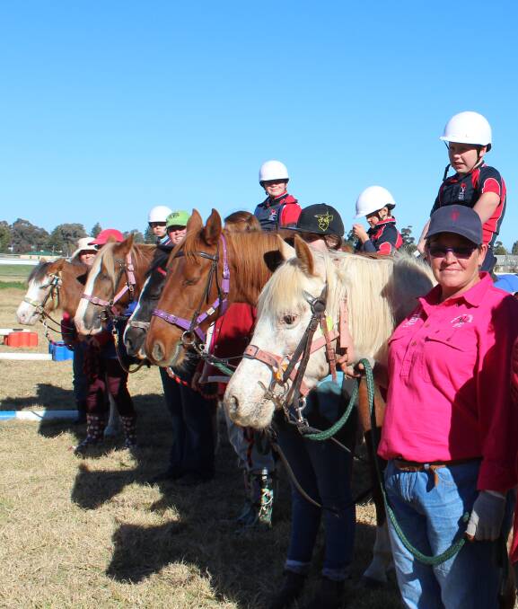 Students and volunteers from Cowra's Riding for the Disabled. Cowra RDA will be holding a sausage sizzle fundraiser on July 1 outside of Aldi. 