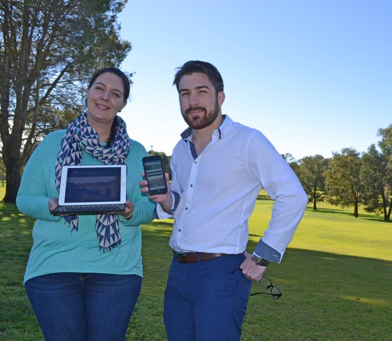 Kristy Bognar from the Cowra Golf Club with Cowra Guardian Sales Consultant Brent Young showcasing the new and improved Golf Club website on both tablet and smartphone. 
