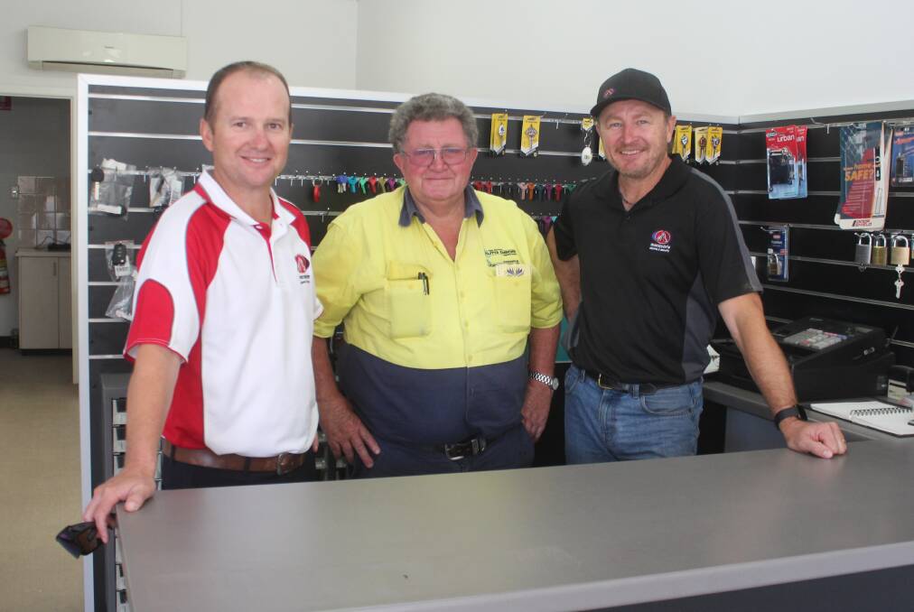 Murray Alchin has handed over the keys to Cowra Locksmiths to Cameron Humphries and Peter Hyde of Macquarie Alarm Services. 