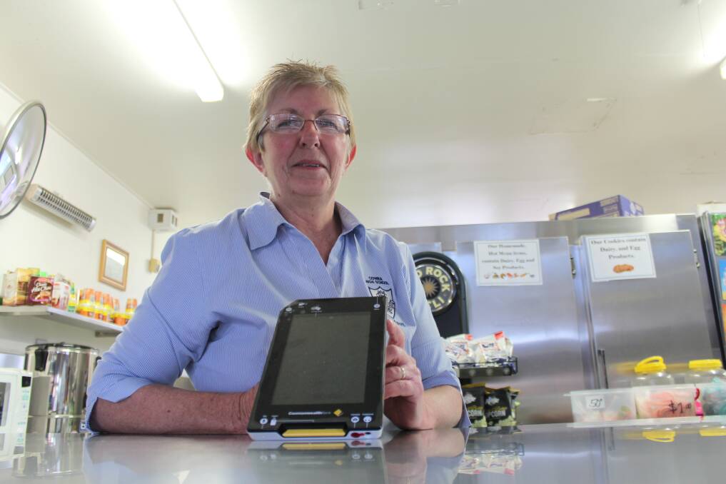 Cowra High School Canteen Manager Judy Core with the Albert EFTPOS machine that students and staff can now use to purchase food and drinks from the canteen. 