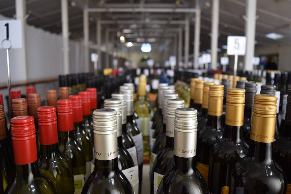 Thousands of bottles of wine are set out in the Cowra Showground Pavilion in preparation for the judging, which starts on Monday. 