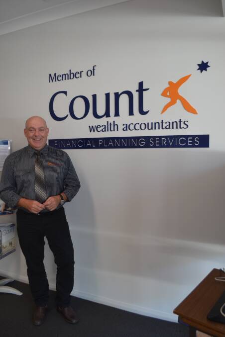 Financial Planner Jim McNaught in his new office in the Finance Centre at 93 Kendal St.  Calare Financial Services can help meet your dynamic, financial goals. 
