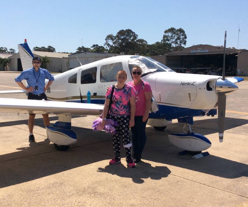 Local girl Karley Miller with her mum Nikki Miller and Fly Oz pilot Mark Dixon after one of Karley's Angel Flights to Sydney for life changing surgeries. 