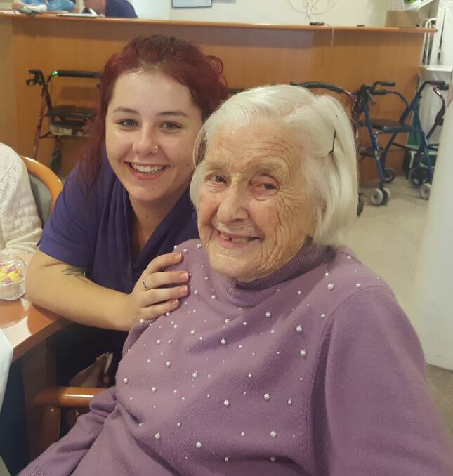 Lara Rust from Weeroona Aged Care Residence and resident Margaret Bryant make cupcakes to celebrate Mother's Day. 