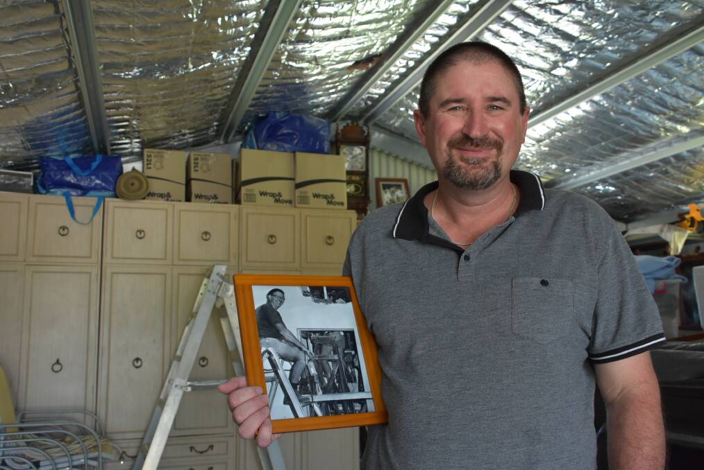 Gooloogong man Greg Connell with a picture of his father Cletus. Cletus tragically committed suicide after battling terminal cancer. 