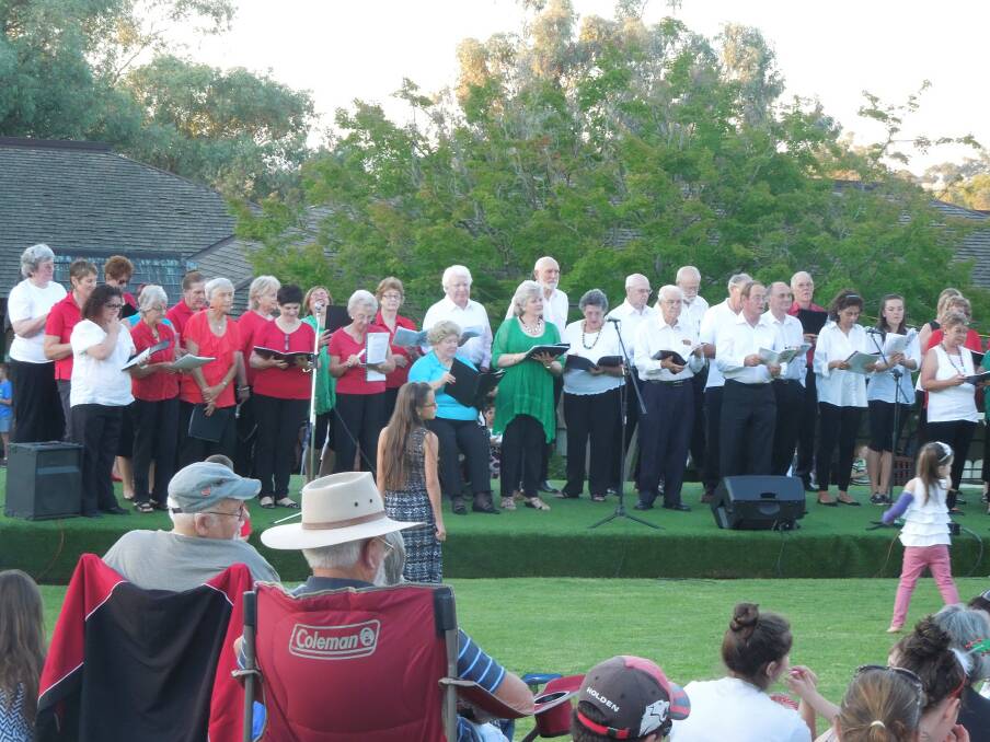 Choirs performing at last year's Carols in the Garden. The event will be held this Sunday at the Cowra Japanese Garden. 