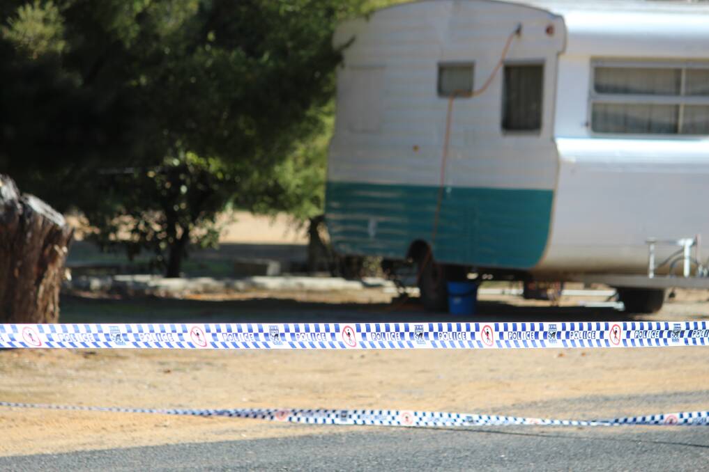 Injured woman found at caravan park dies