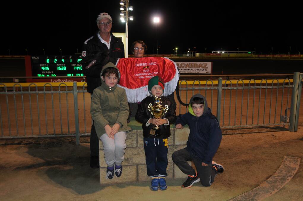 THE CHAMPION: Paul and Pamela Braddon celebrate Falcon's Fury's Gold Cup win with family members at Dawson Park. Photo: NICK GUTHRIE