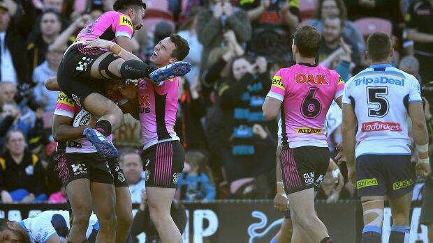 Over the line: The Panthers rejoice after sealing the match. Photo: AAP