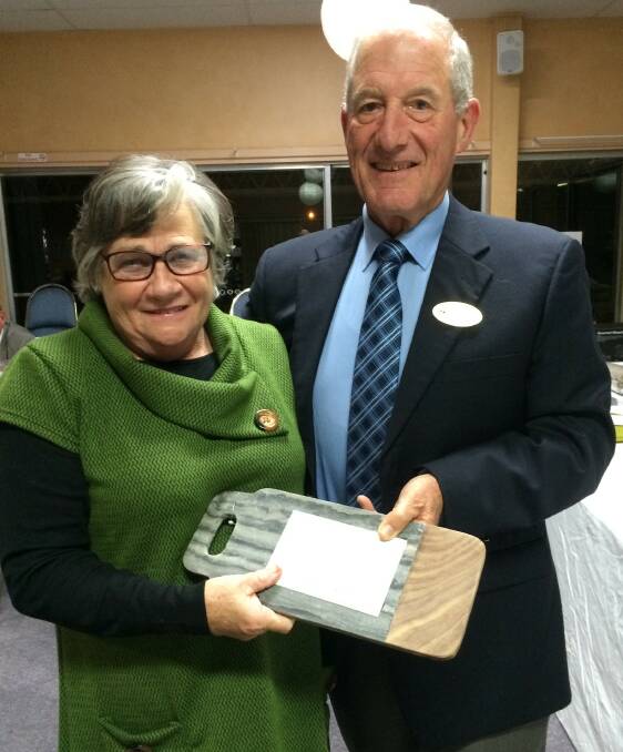 From Moss Vale Elizabeth Shepherd receiving her Trophy from Golf Club President Robert Oliver
