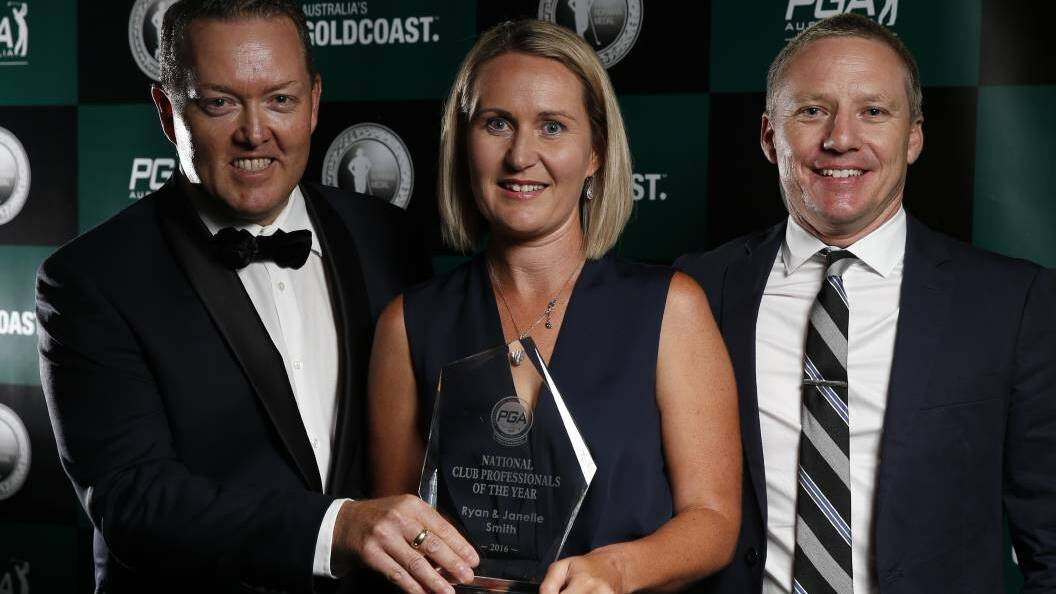 Australian PGA deputy chairman Dave Stretton presents Janelle and Ryan Smith with the national club professionals of the year award.