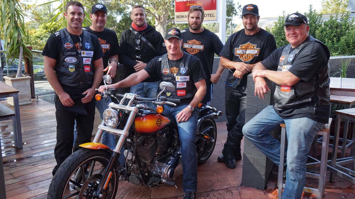 Brad Fittler (left) and a host of former professional rugby league players including Steve Menzies (on bike) will come to Cowra.