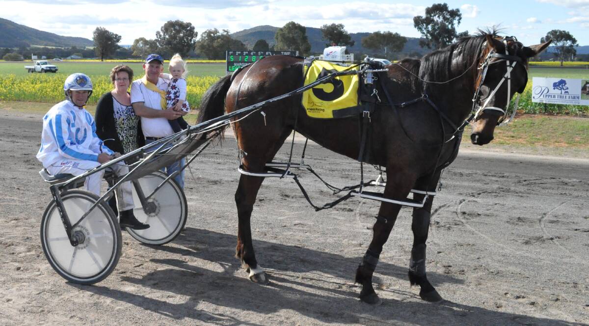 Mat Rue in the gig with Lucy Lamb and trainer Ken Rue with wife Sharon and granddaughter Ella pictured during the 2015 Canola Cup series. Photo by Coffee Photography.