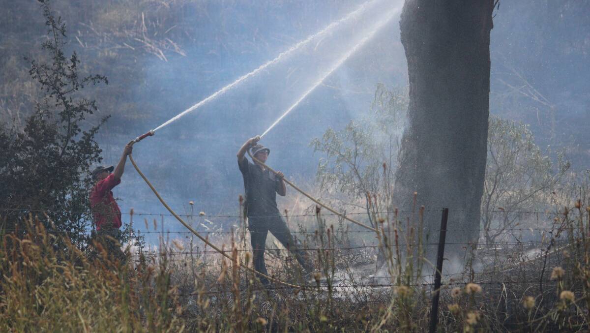 A grass fire near Woodstock is brought under control on Thursday afternoon.