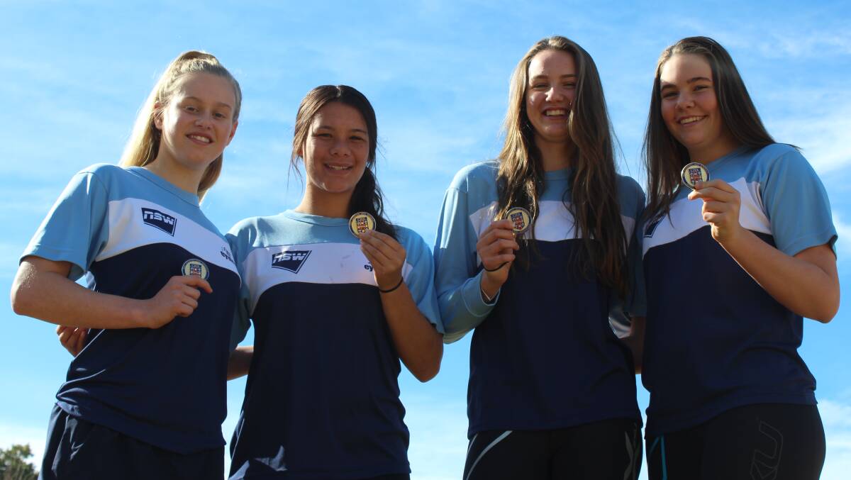 Jade Browne, Jade Te Weehi, Georgia Lewis and Abbie Lewis pictured with their 4 x 50 metre relay gold medals.