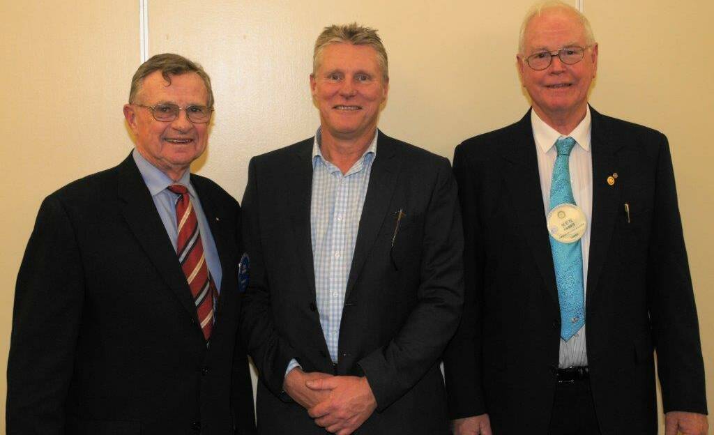 Speaker Michael Brissendon flanked by Chairman Ian Brown (chairman for the night and chairman of Cowra's World Peace Bell Association) and President Ken Harris.
