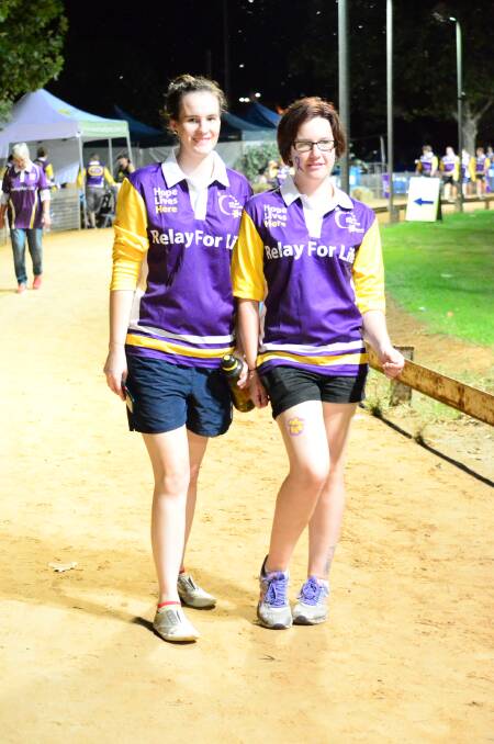 Lily Wright and Rebecca Butcher take to the track on Saturday night for Cowra's Relay for Life. 