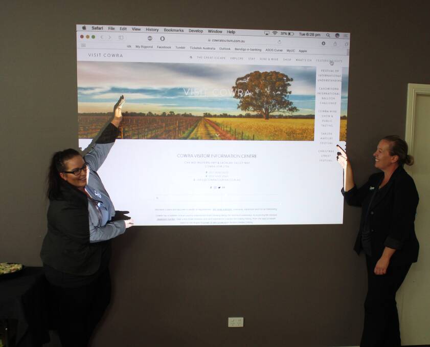 Events and Marketing Officer, Elizabeth Picker and Manager of Cowra Tourism, Belinda Virgo show off the new website at the launch party on Tuesday.