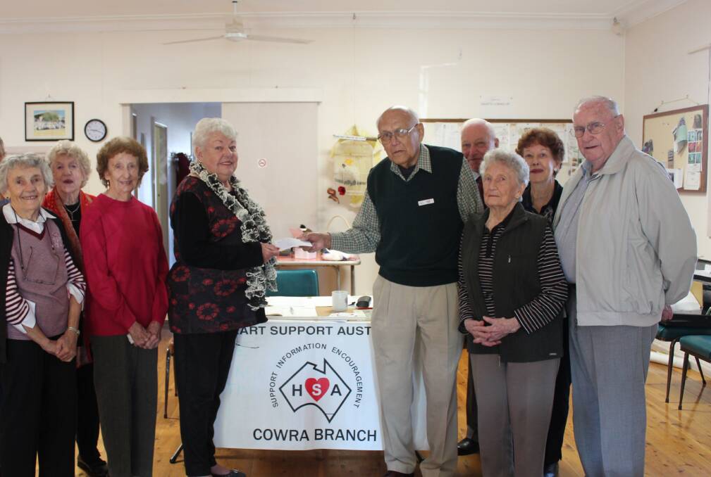 The Heart Support Group (right) donating to the Cowra Hospital Auxiliary. 