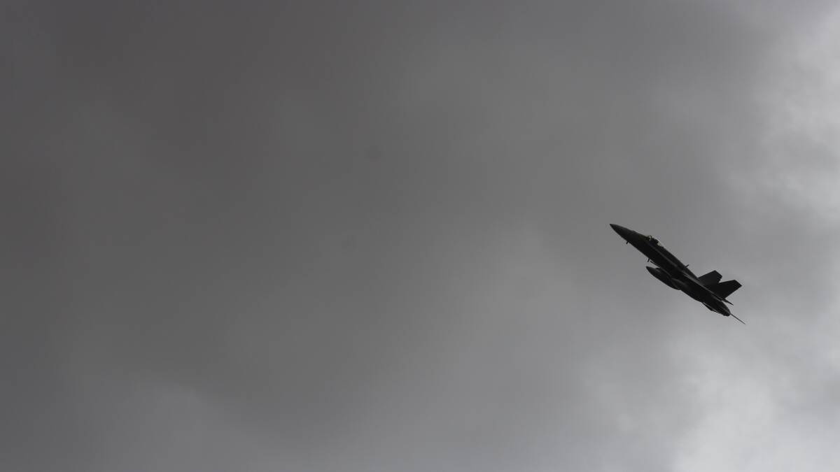 A few shots of Squadron Leader Adrian Kiely's F/A-18 Hornet as it flew over Holmwood Public School.