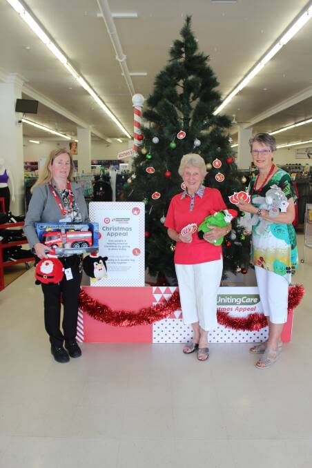 Paula White, Pam Boler and Chris Palazzi are encouraging shoppers to donate to the Target and UnitingCare annual Christmas Appeal.