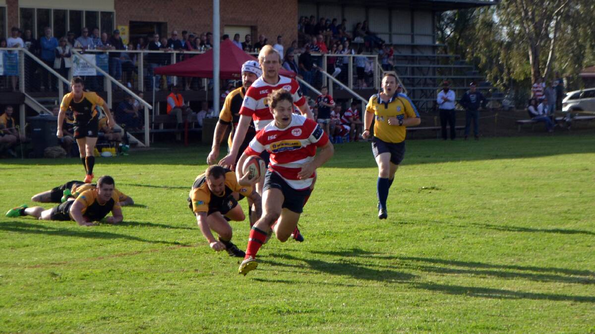 Mitchell Budge leaves the Dubbo Rhinos defence in his wake during Cowra's 80-14 win on Saturday.