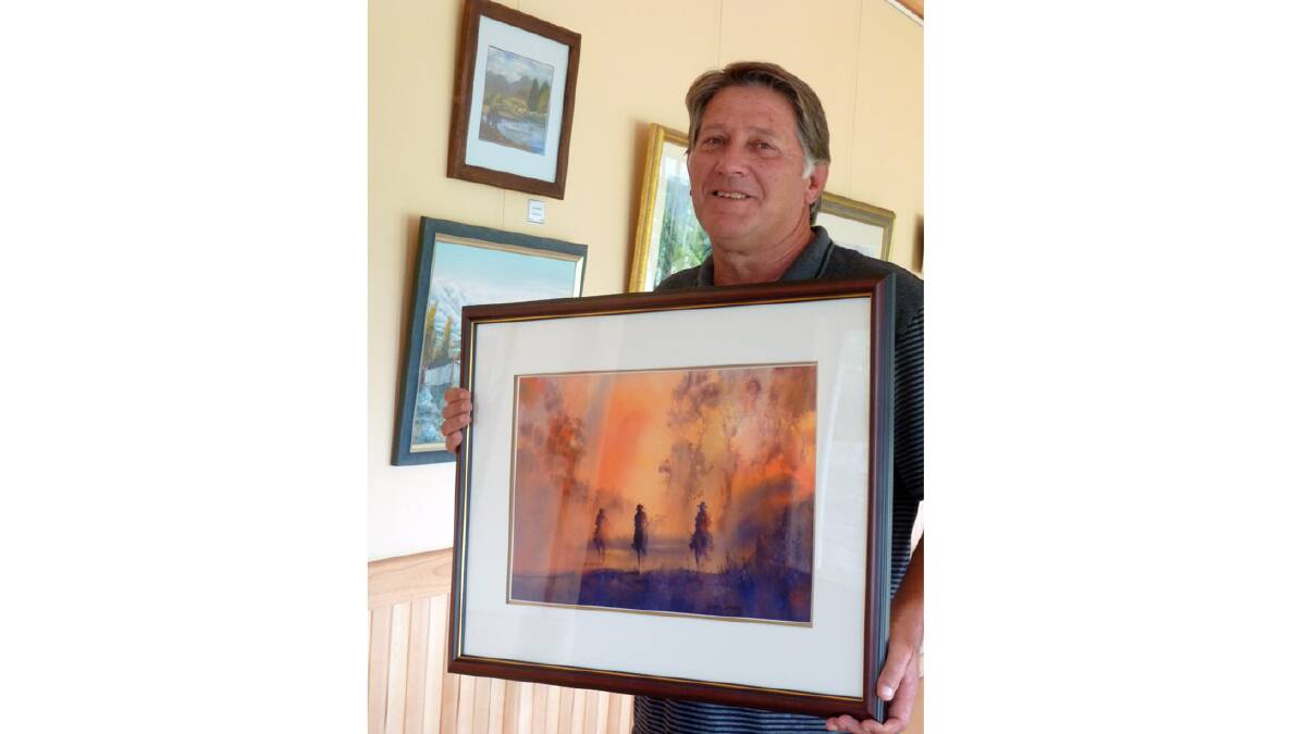 Peter Larsen with his winning watercolour painting. Photo supplied.