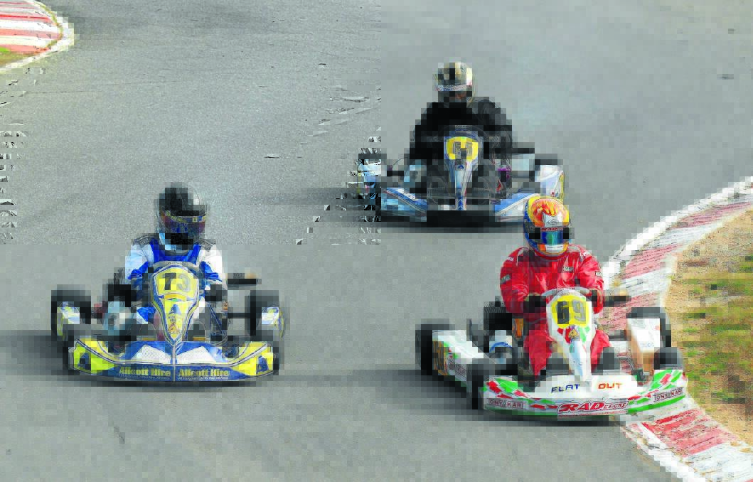 Tom Manwaring (#73) pushes hard on the outside in the latest race kart round at Grenfell.