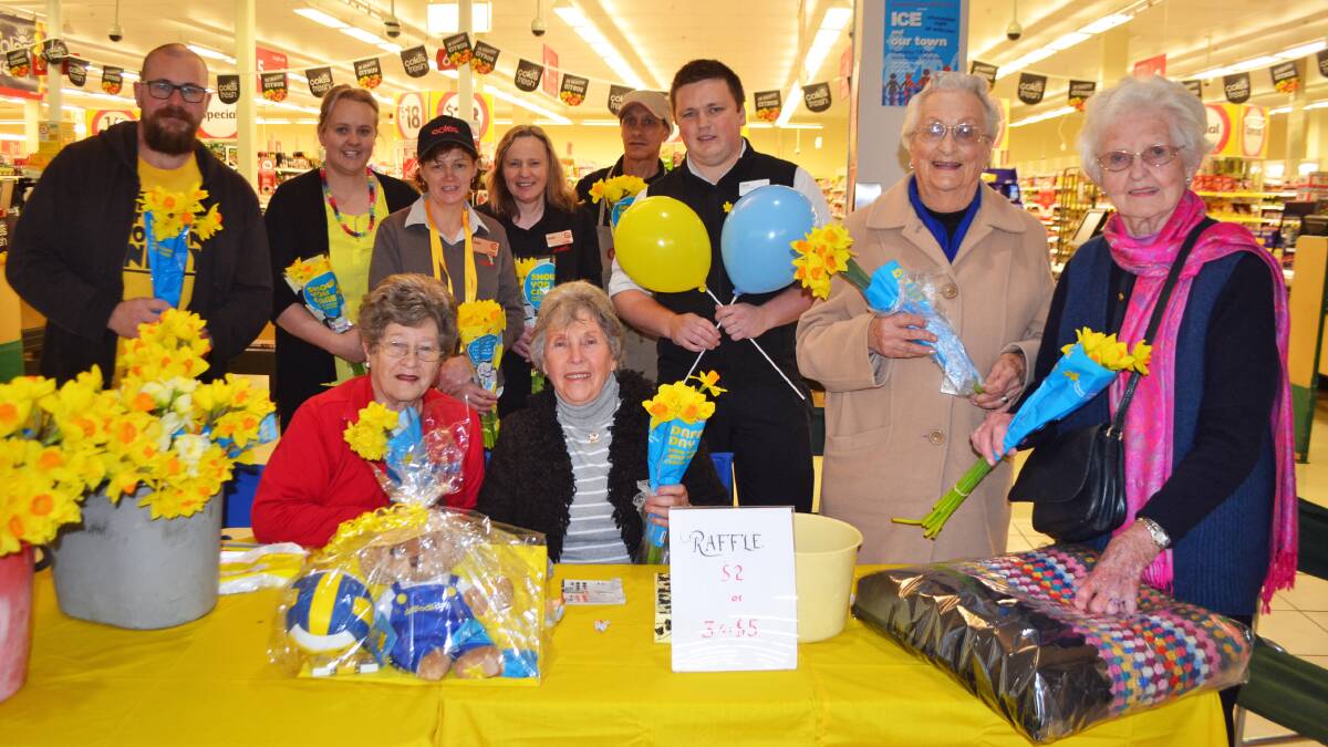 Back row: Coles staff Matt Cremona, Melissa Clarke, Julie Gorham, Vicki and Terry Rawiri and Chris Day, with Cancer Council volunteers Sylvia Pereira, Elaine Donges, Trudy Berry and Hazel Seears.