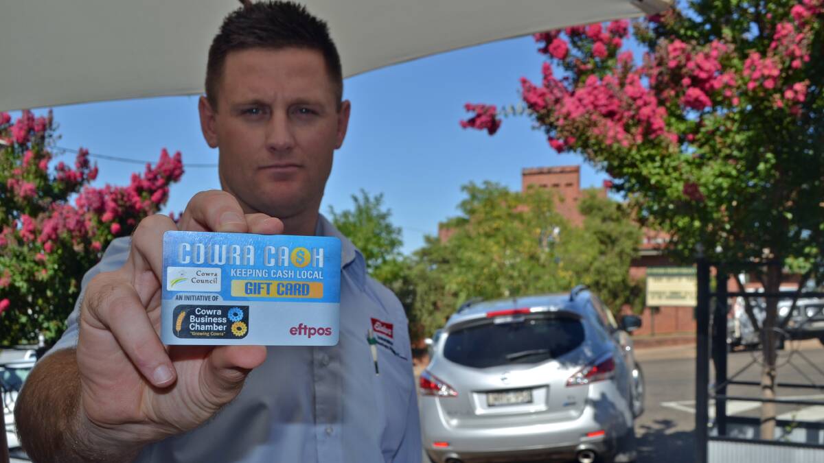 Julian Larsen from Cowra Business Chamber with the Cowra Cash Card.