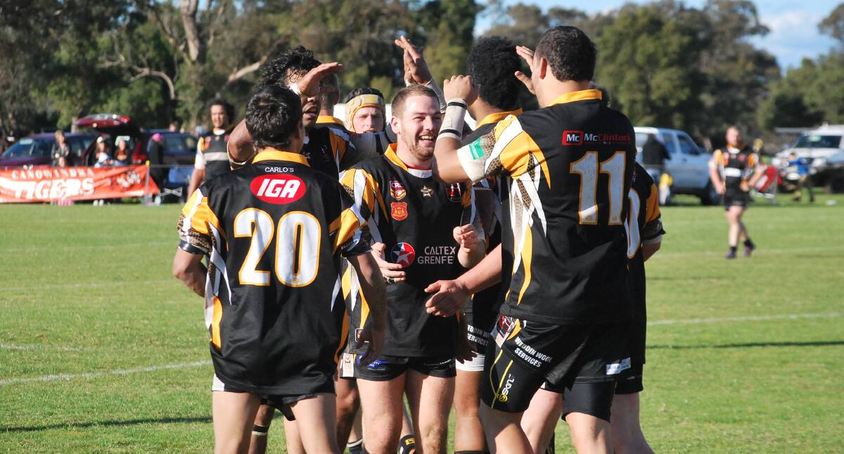 The Grenfell Goannas celebrate a try on Saturday in Gooloogong against the Canowindra Tigers.
