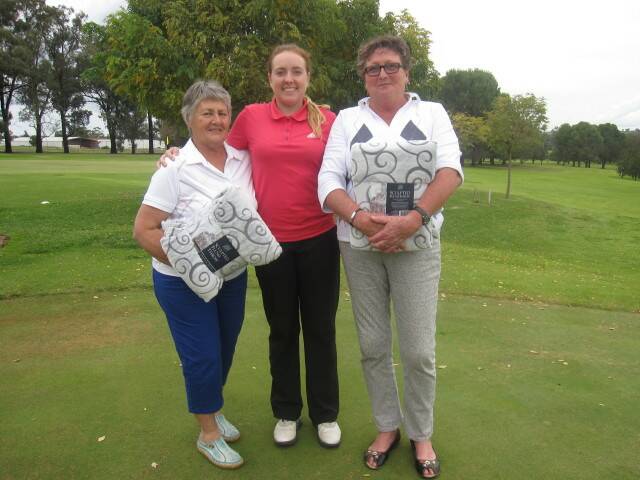 Laura Cummings (centre) with division 2 winner Julie Spolding (left) and division 1 winner Trish Moerkerkan (right).