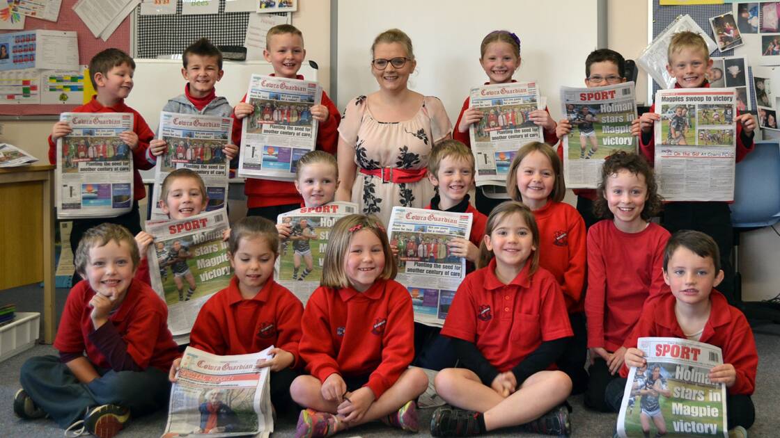Journalist, Belinda Cleary, with the Holmwood Public School students after their class talk.