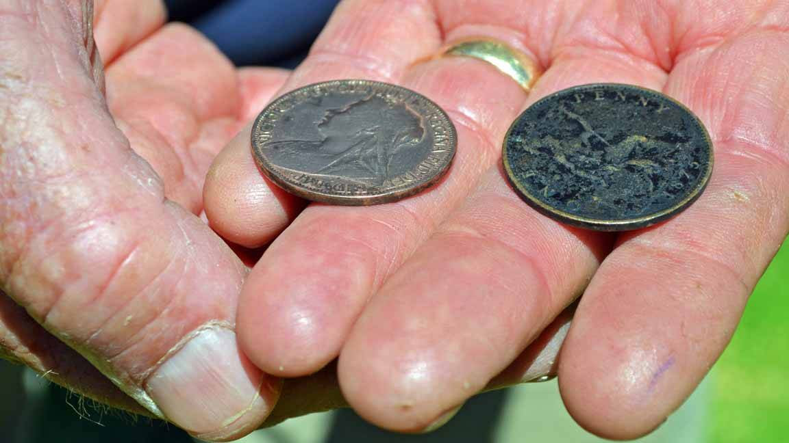 Cowra's Brian Lynch holds two-up pennies, passed down from father to son after his grandfather's service in World War 1.