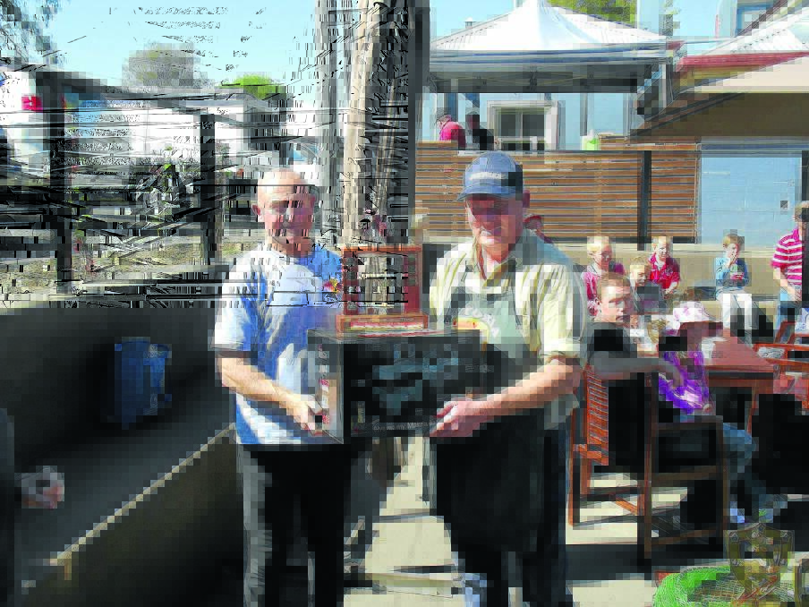 Peter Bruem accepting his trophy and prize from the Railway Hotel Fishing Club's President Gavin Hoy.