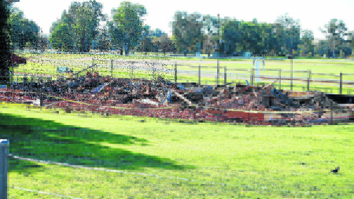 After being demolished in May, Cowra Council is appealing to the state government to pay the $16,264 tip bill for the rubble of the old grandstand. File photo.