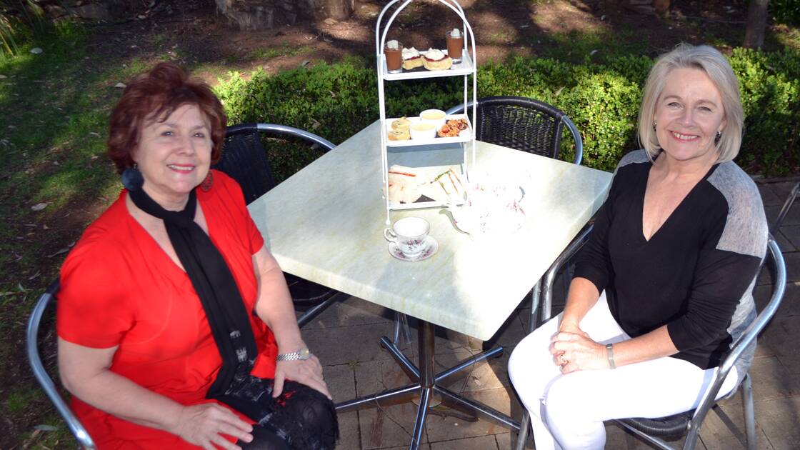 Lynne Jackson and Anne Loveridge prepare for high tea at The Quarry restaurant.