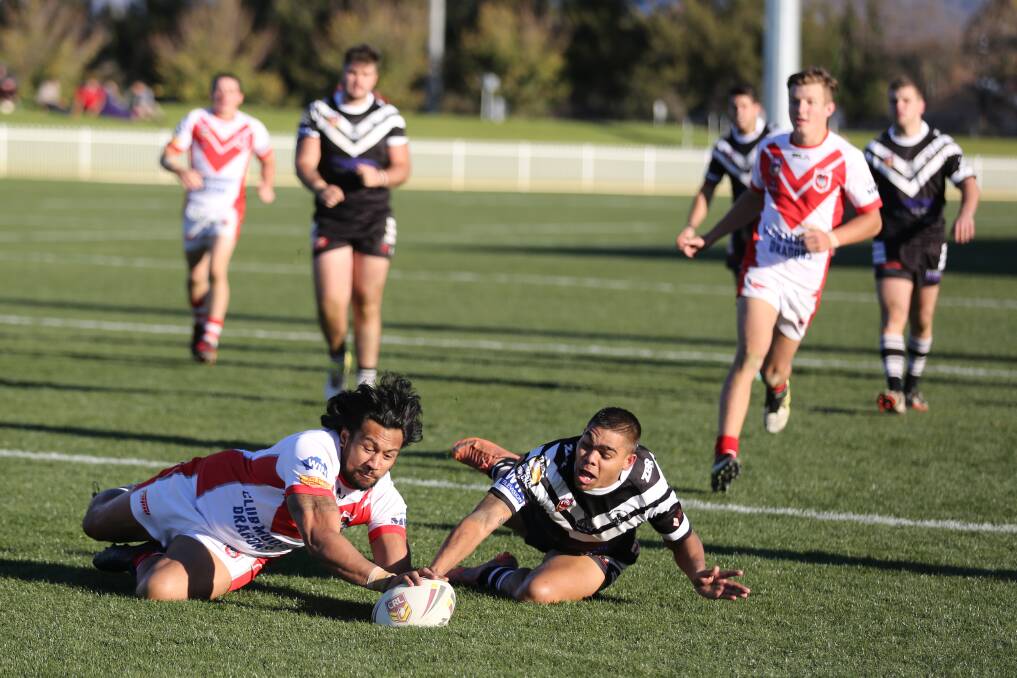 Desi Doolan attempts to stop Jack Afamasaga from scoring a try at Glen Willow Stadium in Mudgee on Sunday. Photo by Brian Jeffery.