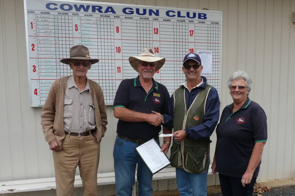 Cowra RDA volunteers Len Crowe and Dudley and Carol Nicholson being presented with a $1500 cheque by Cowra Gun Club President, Peter Mould.
