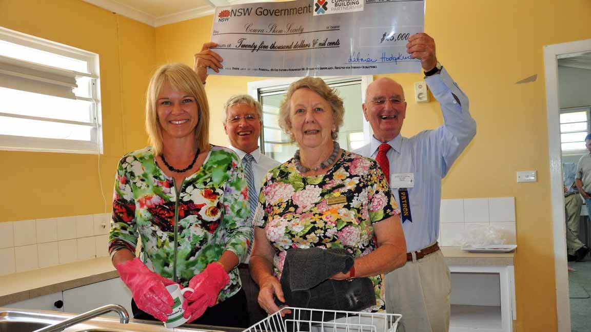 CHEQUE PLEASE: Member for Burrinjuck Katrina Hodgkinson with Cowra Show Society patrons Jenny Armstrong and Ian Armstrong and Show Society president Ian Packer in the kitchens due for a $25,000 upgrade.